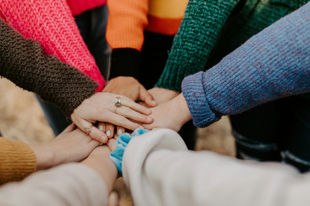 Together we are stronger - hands reaching out to each other